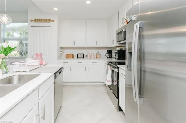 a kitchen with a table and chairs