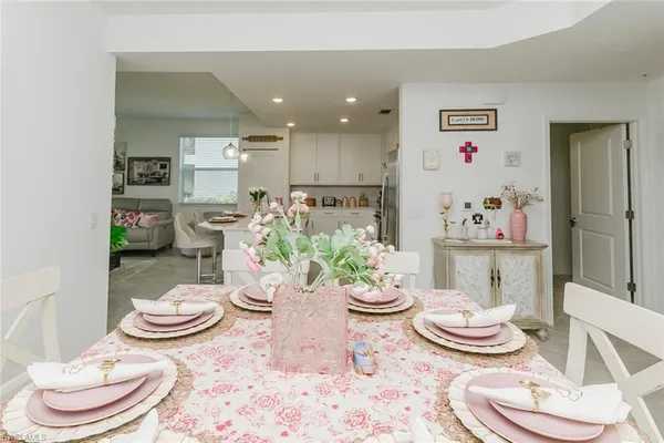 a dining room with furniture and window