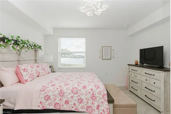 a bathroom with a sink mirror and toilet