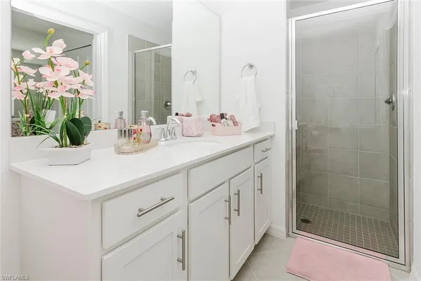 a view of a hallway with white doors