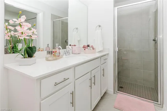 a view of a hallway with white doors