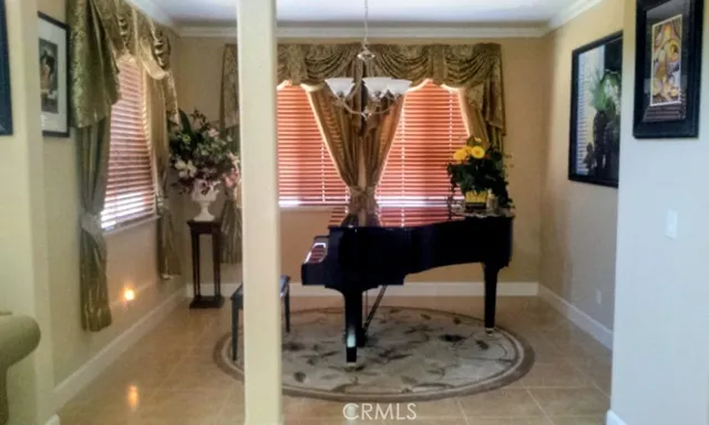 a view of a hallway with living room and furniture