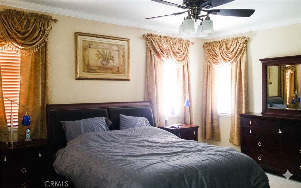 1500 Rio Verde Circle Bay Point, CA 94565 - Photo 29 of 47 a bedroom with a bed and a chandelier
