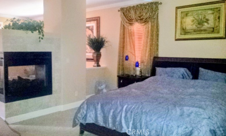 1500 Rio Verde Circle Bay Point, CA 94565 - Photo 30 of 47 a bedroom with a bed and a painting on the wall