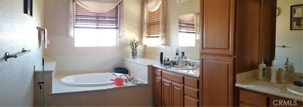 1500 Rio Verde Circle Bay Point, CA 94565 - Photo 34 of 47 a bathroom with a granite countertop sink and a mirror