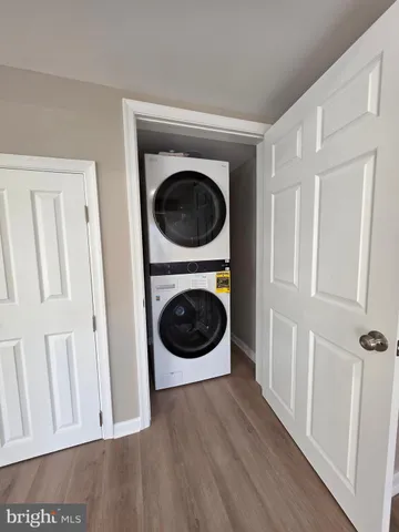 a view of a hallway with washer and dryer