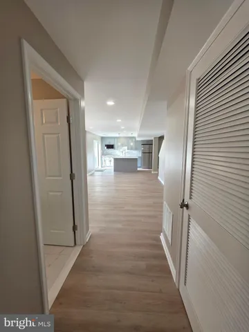 a view of gallery with wooden floor