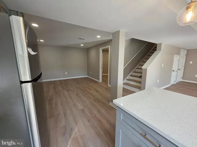 an entryway in a hall with wooden floor