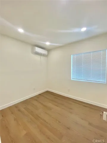 an empty room with a empty space and window