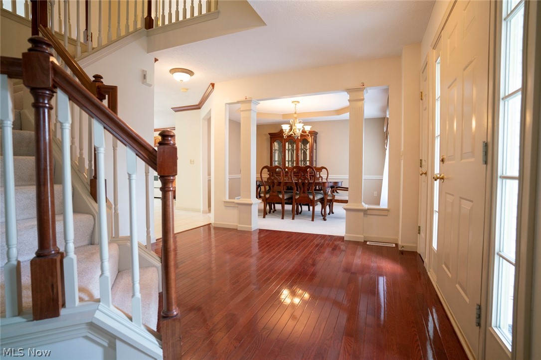 1380 Walnut Ridge Drive Uniontown, OH 44685 - Photo 9 of 35 Large Foyer looking into Dining Room with decorative fluted columns!