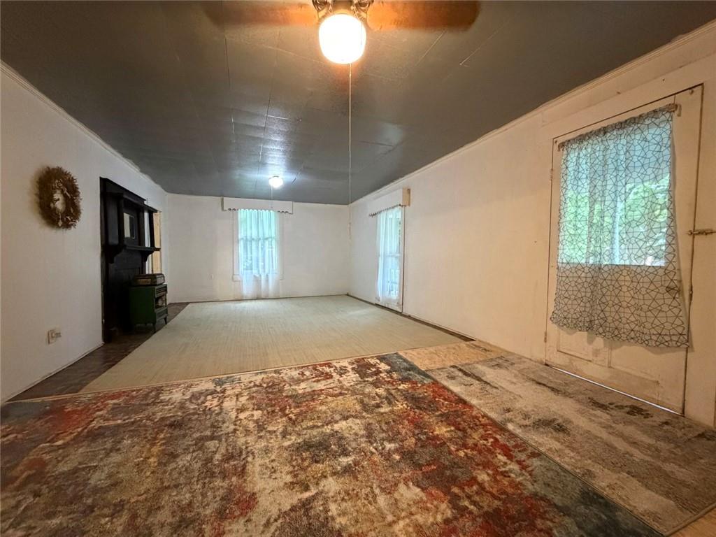 209 Old Perry Road Marshallville, GA 31057 - Photo 32 of 40 a view of empty room with window and ceiling fan