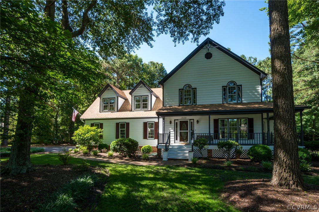 a front view of a house with a yard table and chairs