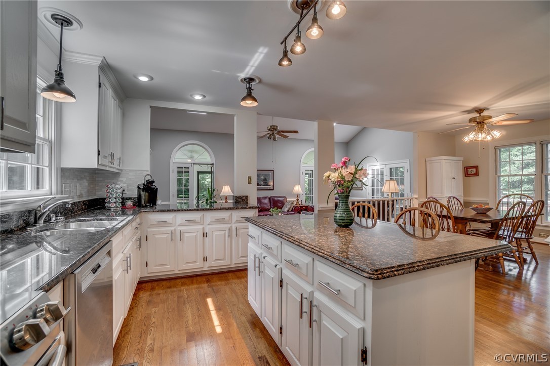 13131 Drakewood Road Midlothian, VA 23113 - Photo 13 of 29 a kitchen with sink stove and cabinets