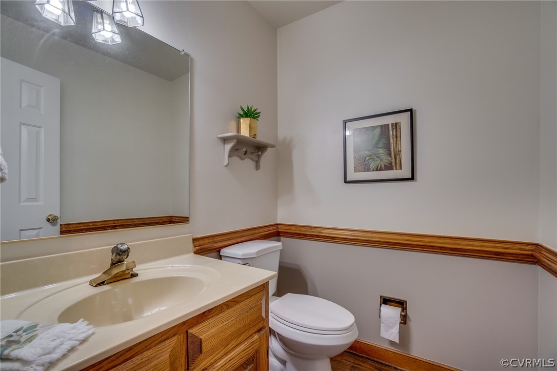 13131 Drakewood Road Midlothian, VA 23113 - Photo 19 of 29 a bathroom with a granite countertop sink and a mirror