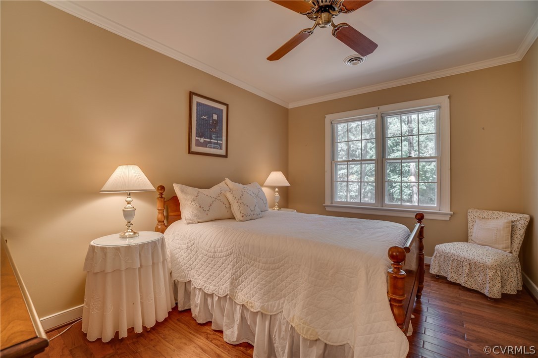 13131 Drakewood Road Midlothian, VA 23113 - Photo 23 of 29 a bedroom with a bed and wooden floor