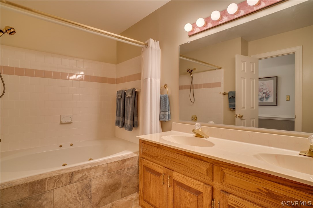13131 Drakewood Road Midlothian, VA 23113 - Photo 24 of 29 a bathroom with a bathtub and a sink