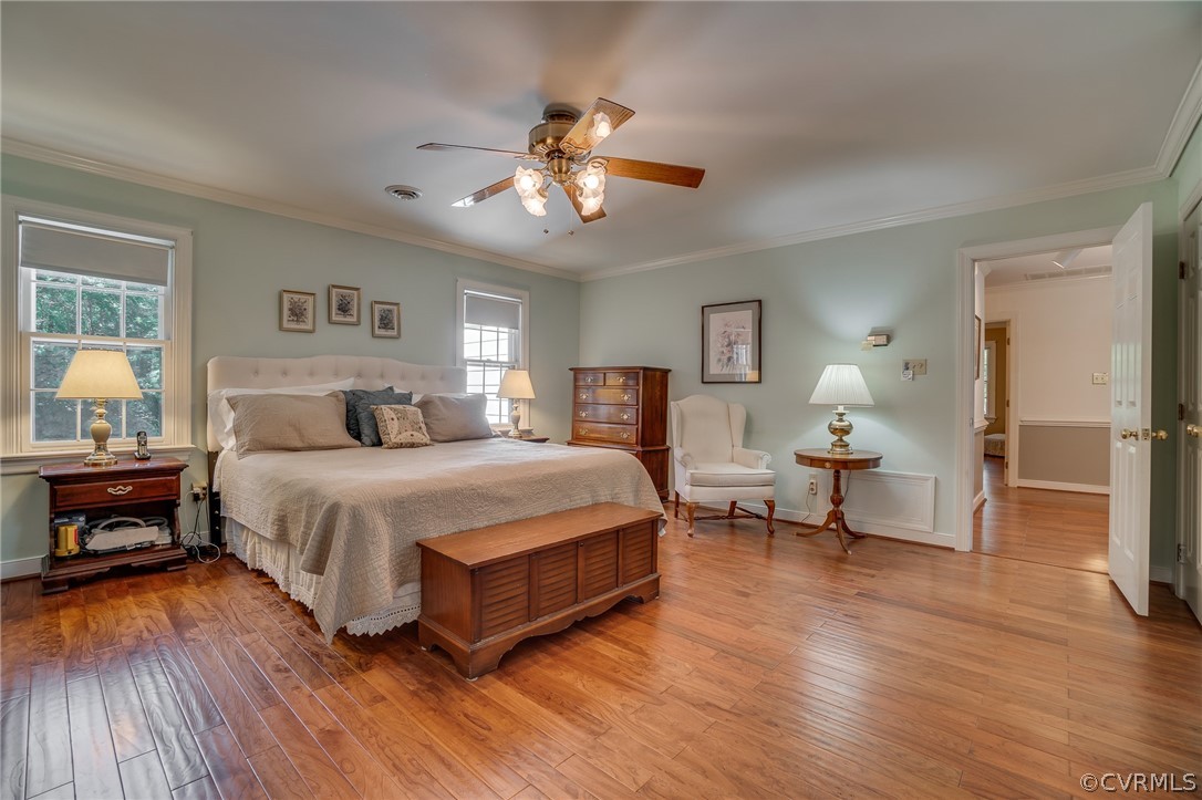 13131 Drakewood Road Midlothian, VA 23113 - Photo 26 of 29 a bedroom with a bed and wooden floor