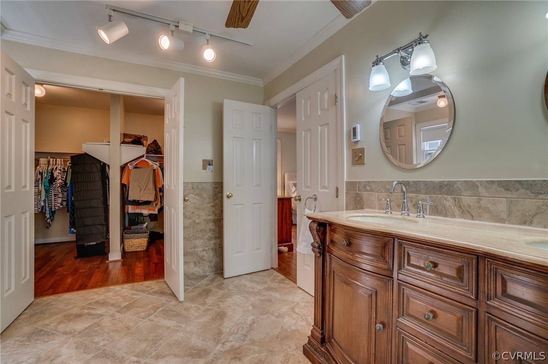 13131 Drakewood Road Midlothian, VA 23113 - Photo 28 of 29 a bathroom with a sink a light fixture and a mirror