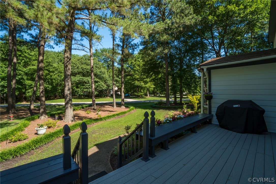 13131 Drakewood Road Midlothian, VA 23113 - Photo 3 of 29 a view of a chairs and fire pit in the yard next to a yard