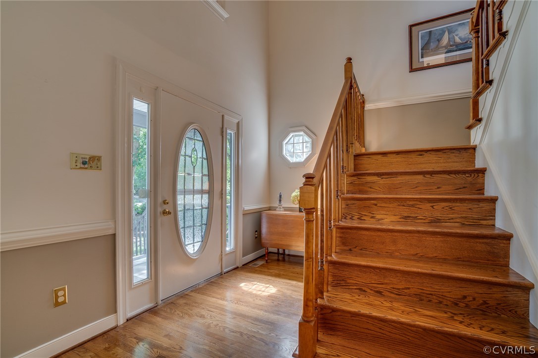 13131 Drakewood Road Midlothian, VA 23113 - Photo 5 of 29 a view of a hallway with entryway wooden floor and front door