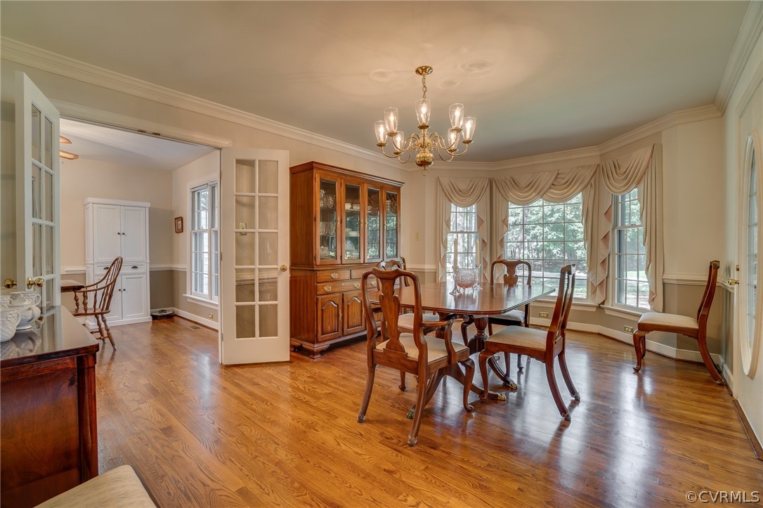 13131 Drakewood Road Midlothian, VA 23113 - Photo 7 of 29 a view of a dining room with furniture window and wooden floor