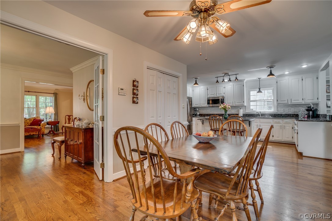 13131 Drakewood Road Midlothian, VA 23113 - Photo 9 of 29 a dining room with furniture and wooden floor