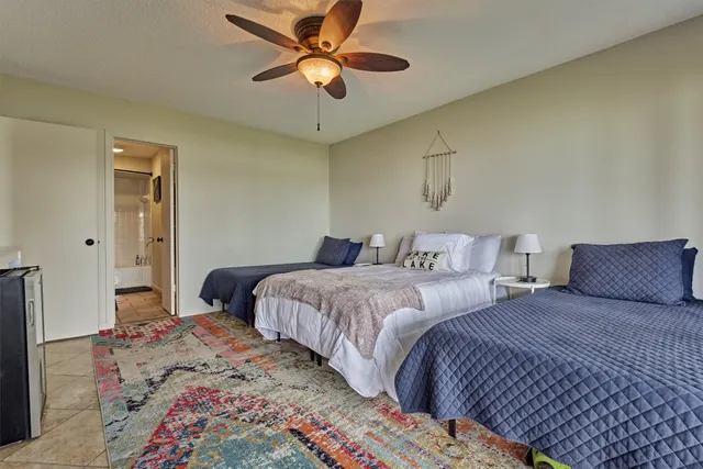 a dining room with furniture a chandelier and wooden floor