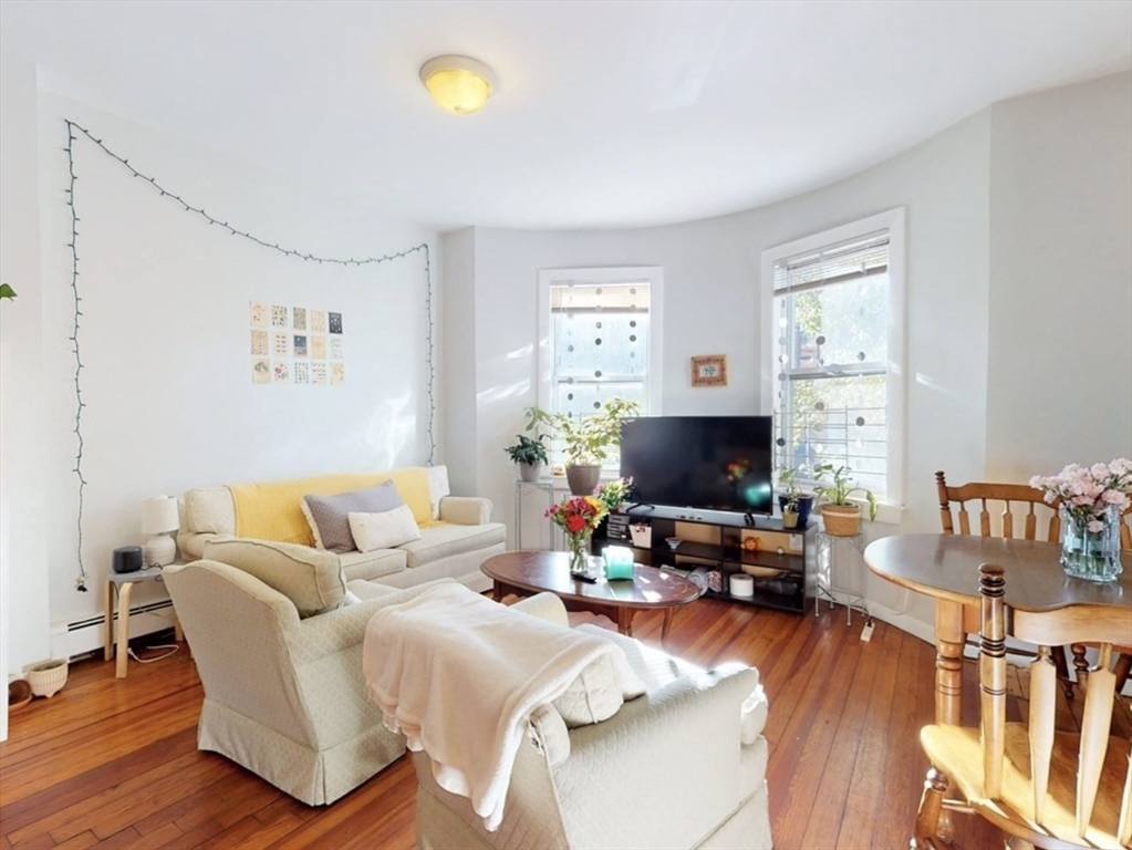 32 South Huntington Avenue, Unit 1 Boston, MA 02130 - Photo 1 of 17 a living room with furniture and a flat screen tv