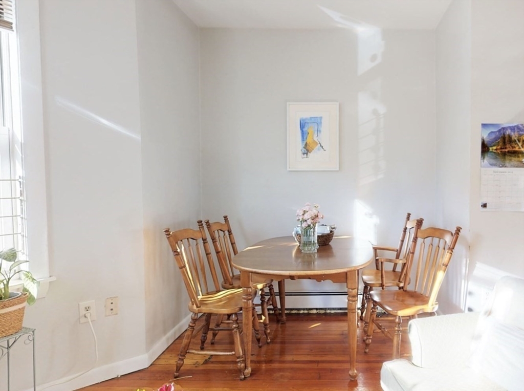 32 South Huntington Avenue, Unit 1 Boston, MA 02130 - Photo 3 of 17 a dining room with furniture and wooden floor