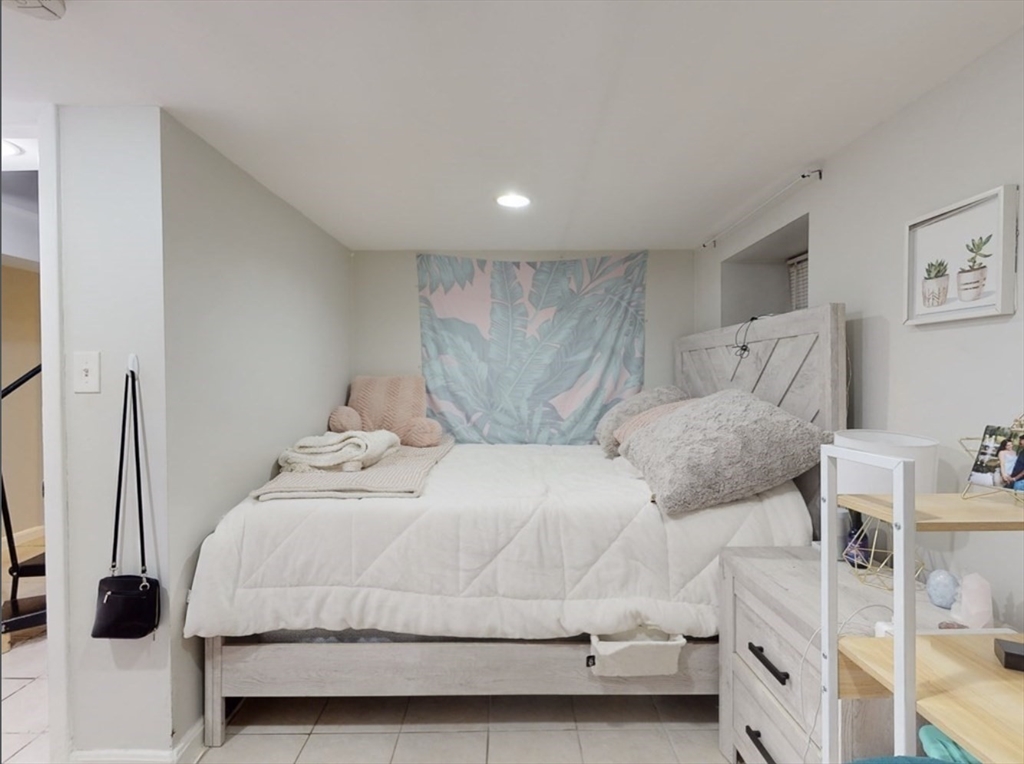 32 South Huntington Avenue, Unit 1 Boston, MA 02130 - Photo 10 of 17 a bedroom with a bed and a dresser