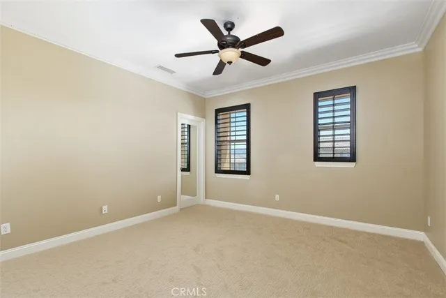 a view of room with a ceiling fan