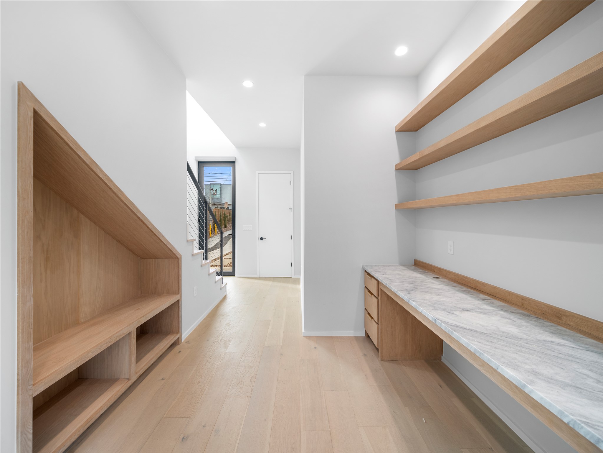 2107 Brackenridge Street, Unit B Austin, TX 78704 - Photo 13 of 36 a view of hallway with stairs and wooden floor