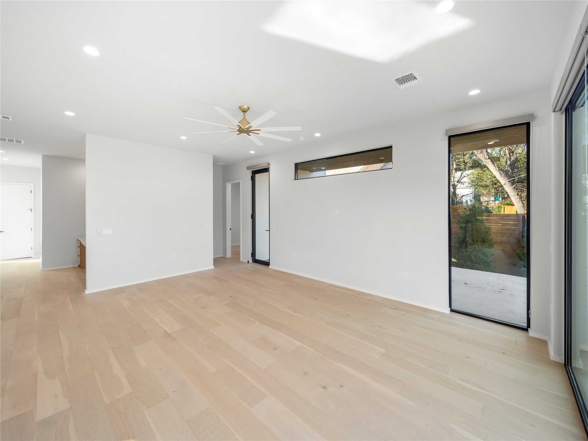 2107 Brackenridge Street, Unit B Austin, TX 78704 - Photo 16 of 36 a view of an empty room with glass door