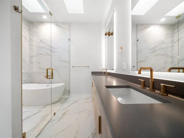 a bathroom with a sink and mirror