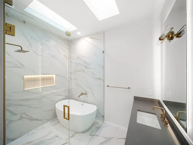 a bathroom with double sink and a mirror