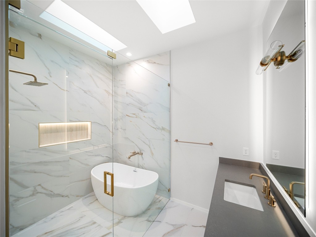 2107 Brackenridge Street, Unit B Austin, TX 78704 - Photo 21 of 36 a bathroom with a sink and a mirror