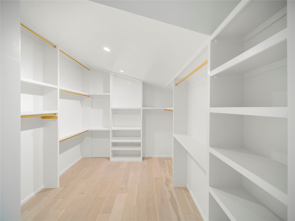 2107 Brackenridge Street, Unit B Austin, TX 78704 - Photo 23 of 36 Spacious closet featuring light wood-style floors and vaulted ceiling