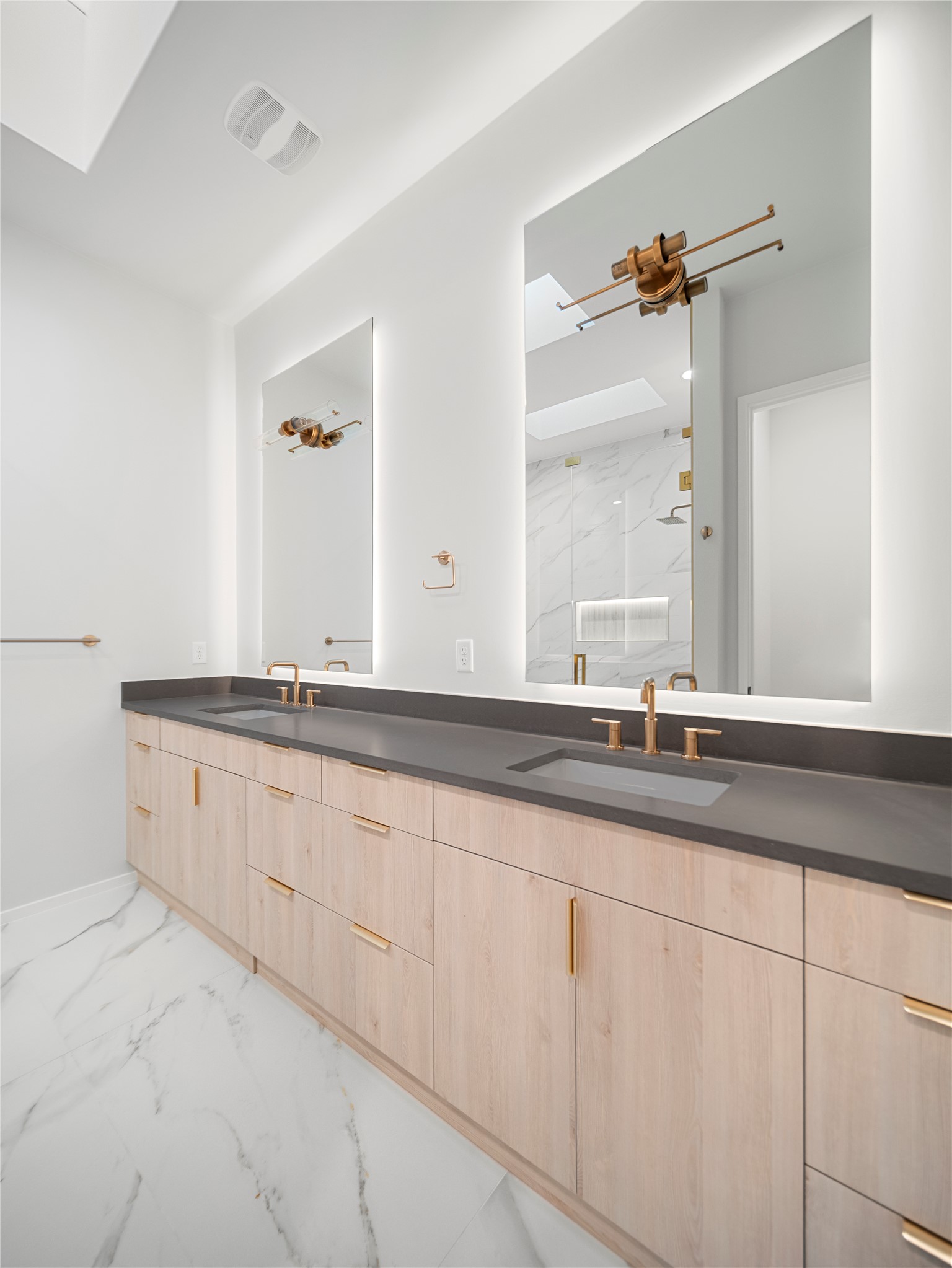 2107 Brackenridge Street, Unit B Austin, TX 78704 - Photo 24 of 36 a bathroom with double sink and a mirror