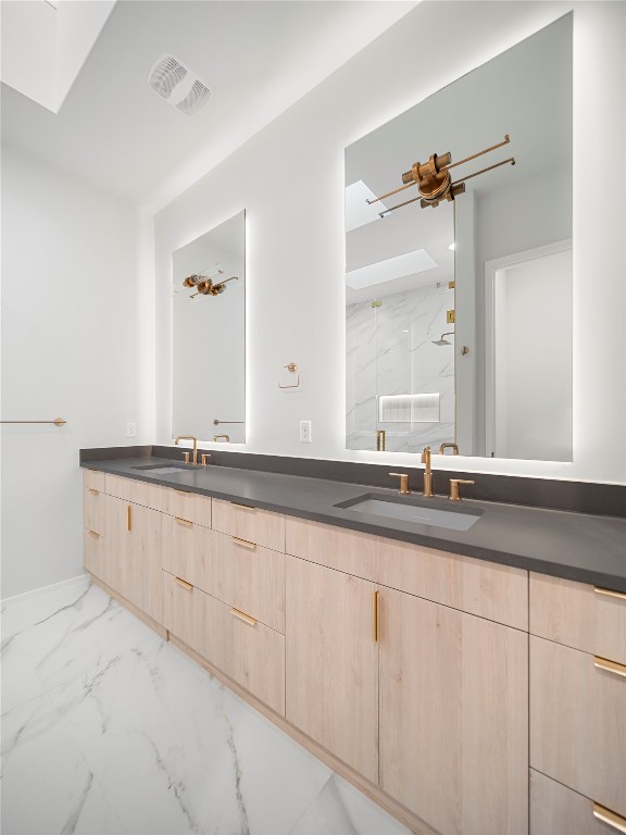 2107 Brackenridge Street, Unit B Austin, TX 78704 - Photo 24 of 36 a bathroom with double sink and a mirror