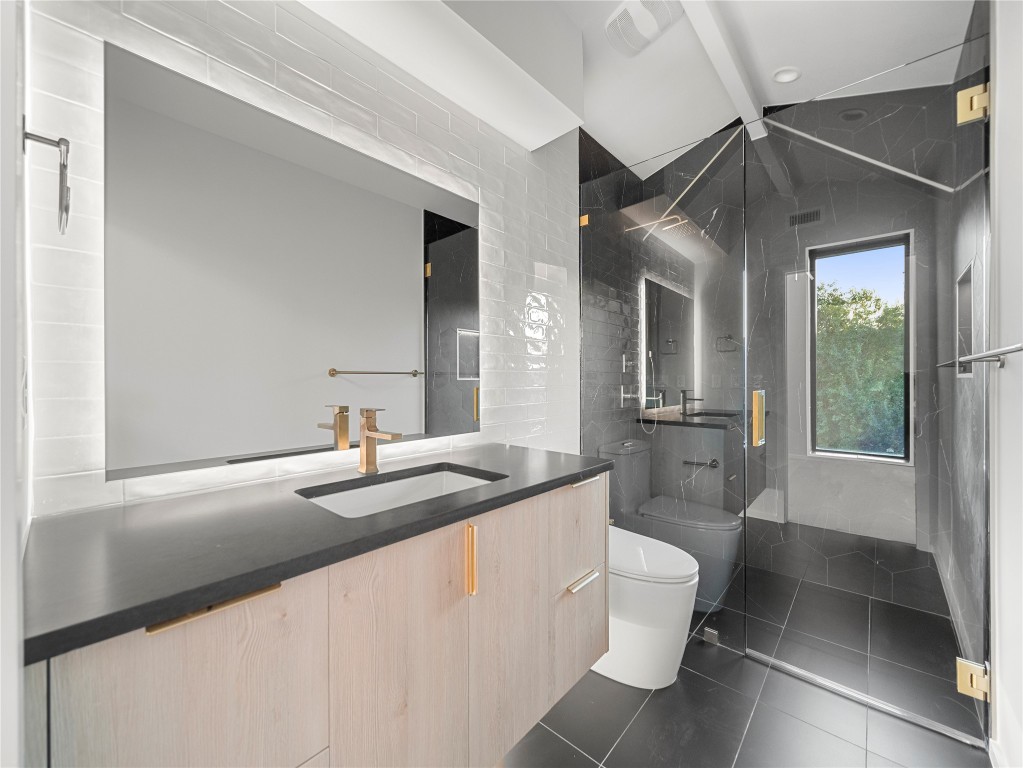 2107 Brackenridge Street, Unit B Austin, TX 78704 - Photo 25 of 36 a bathroom with a sink toilet and shower