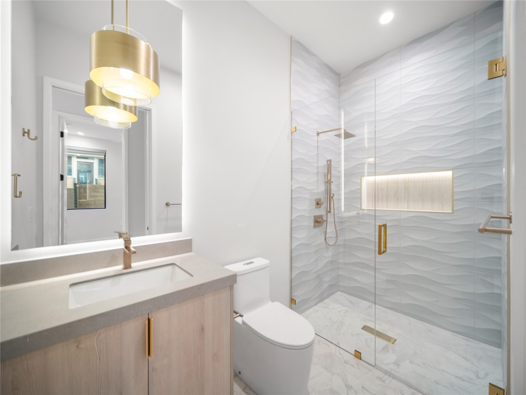 2107 Brackenridge Street, Unit B Austin, TX 78704 - Photo 27 of 36 a bathroom with a sink toilet and shower