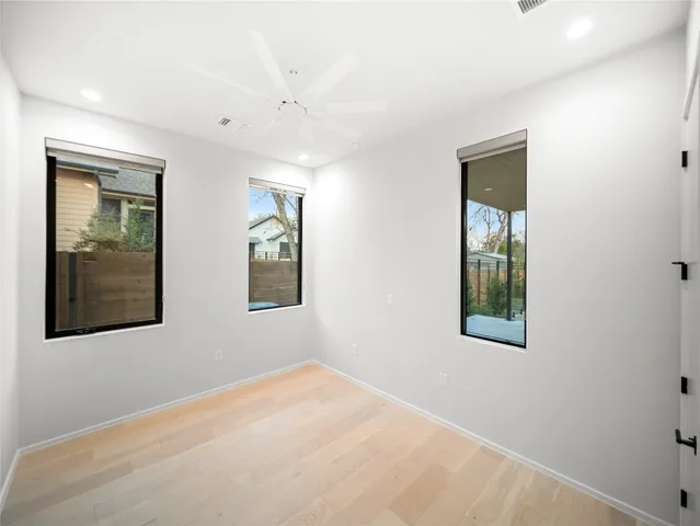 a view of a house with a door and a bench