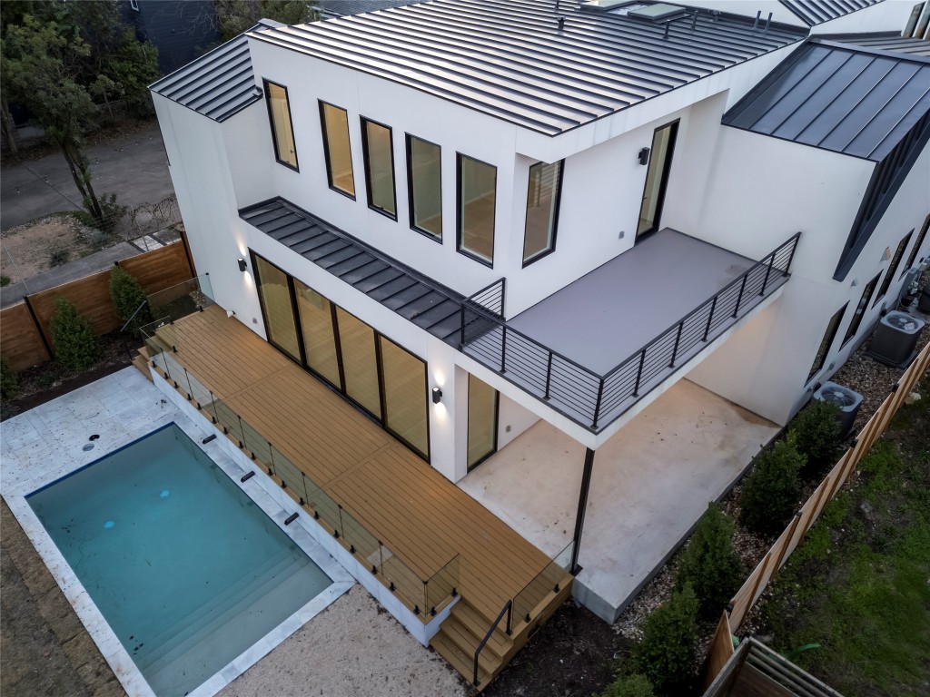 2107 Brackenridge Street, Unit B Austin, TX 78704 - Photo 32 of 36 a view of a house with pool and wooden stairs