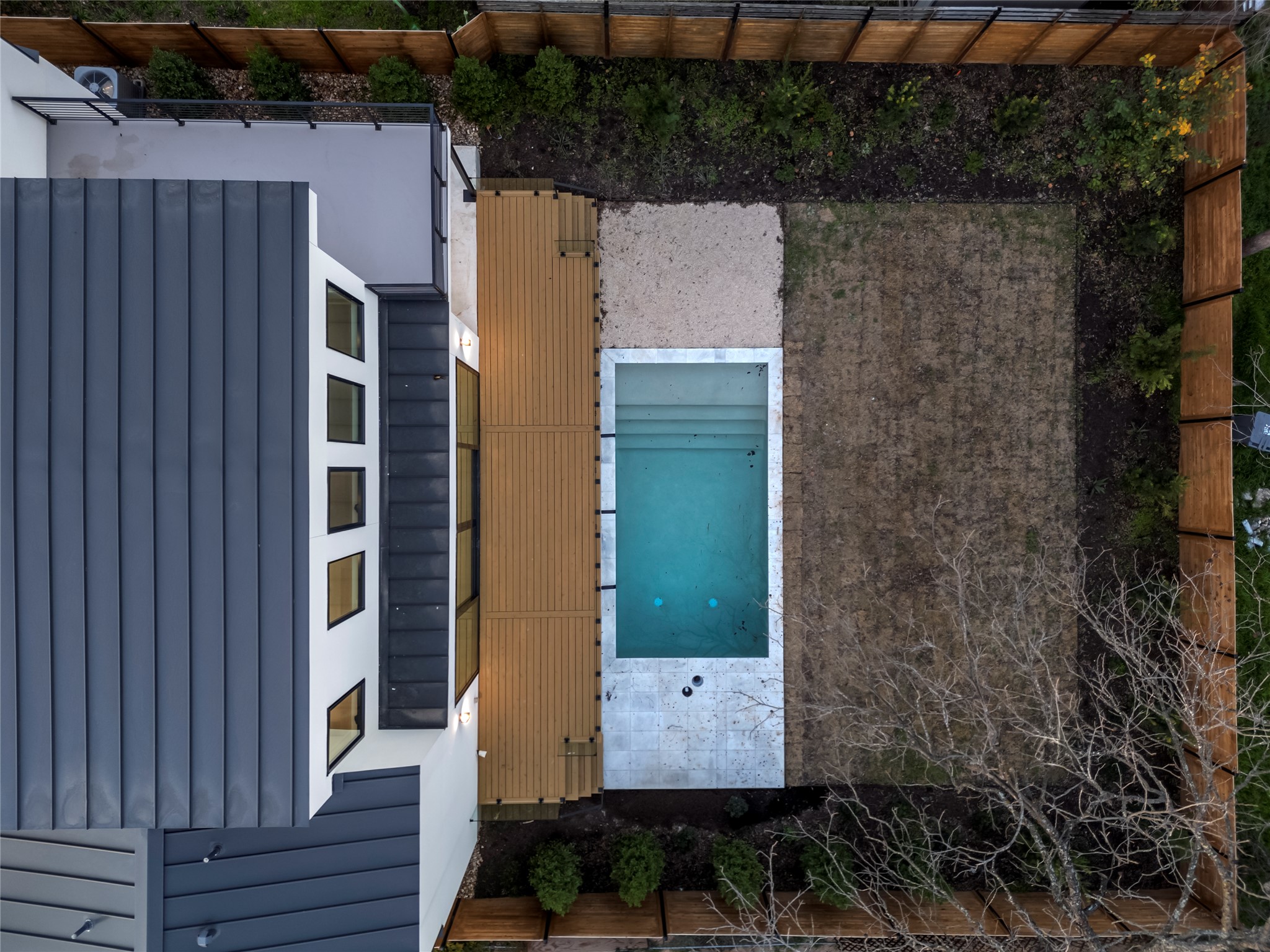 2107 Brackenridge Street, Unit B Austin, TX 78704 - Photo 33 of 36 a view of a house with a door and a bench