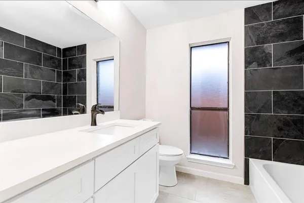 a bathroom with a sink and a shower