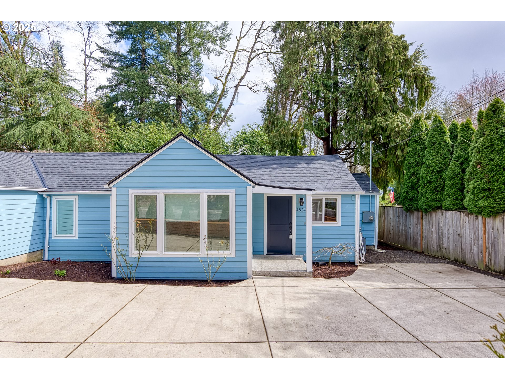 a house with trees in the background