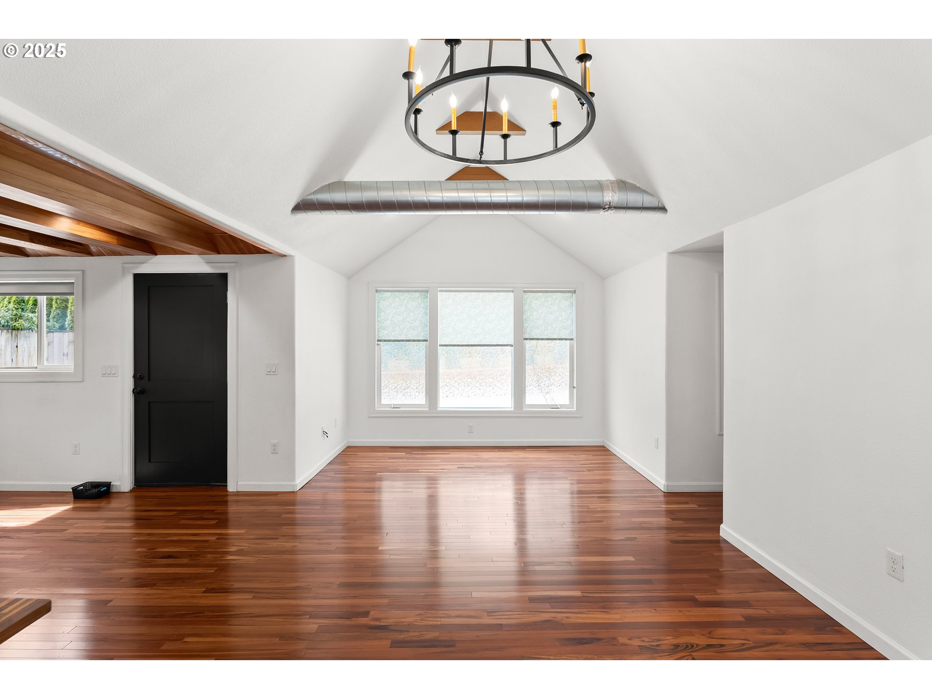 4824 Southwest Shattuck Road Portland, OR 97221 - Photo 3 of 28 a view of room with wooden floor and window