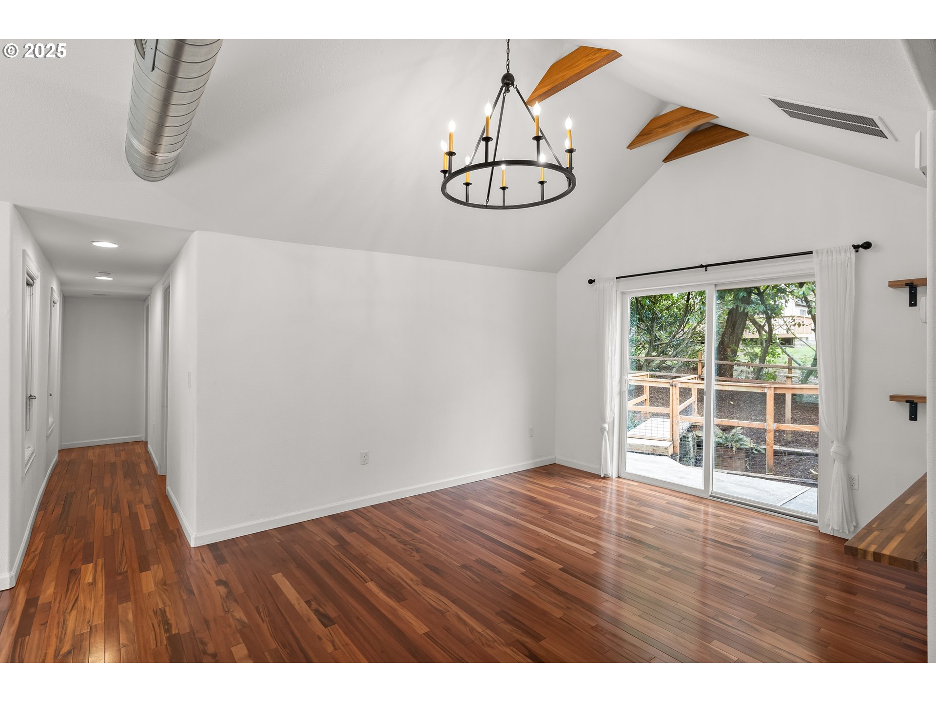 4824 Southwest Shattuck Road Portland, OR 97221 - Photo 6 of 28 a view of empty room with wooden floor