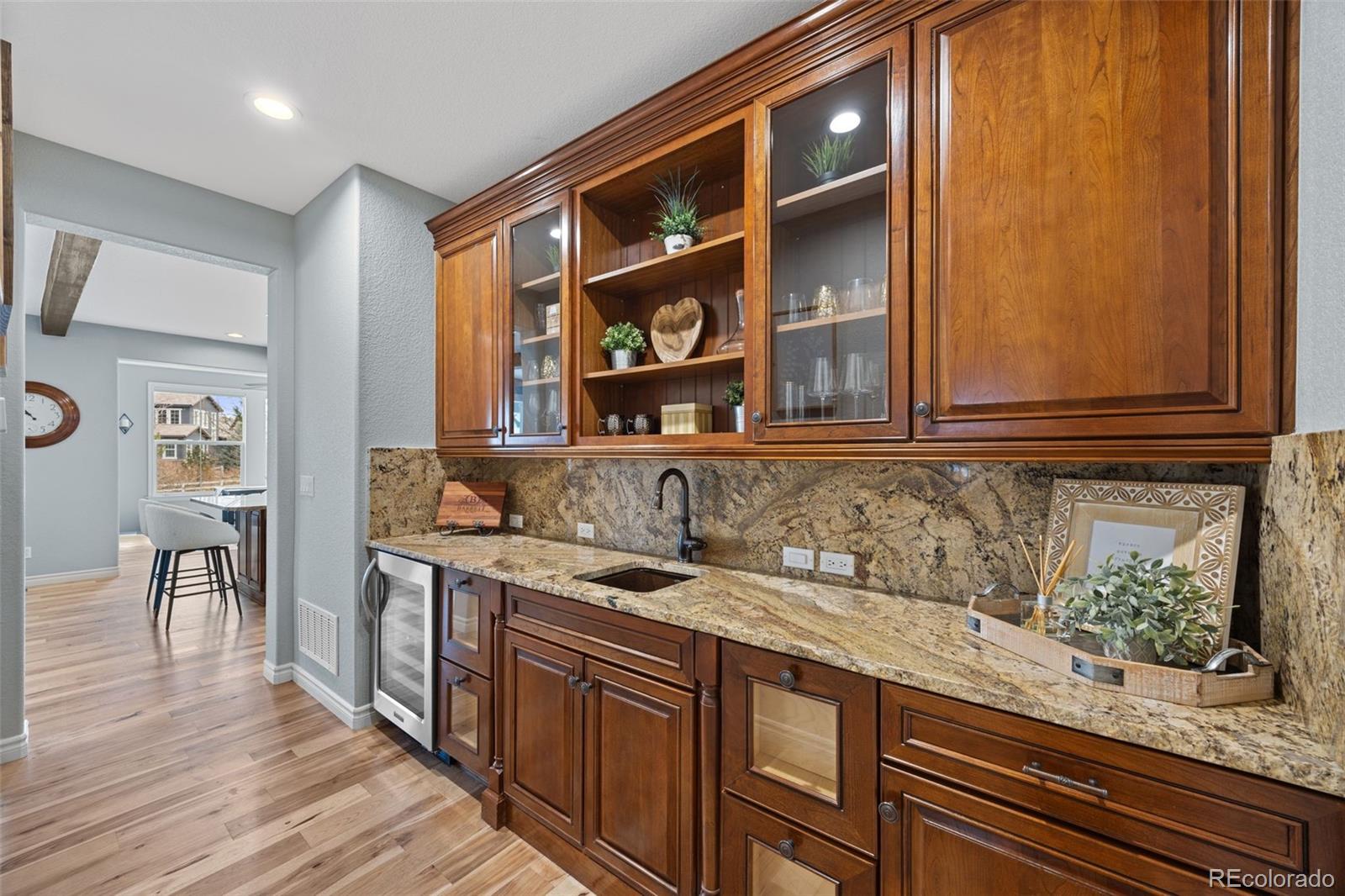 10466 Marigold Court Highlands Ranch, CO 80126 - Photo 12 of 50 a kitchen with a sink and cabinets