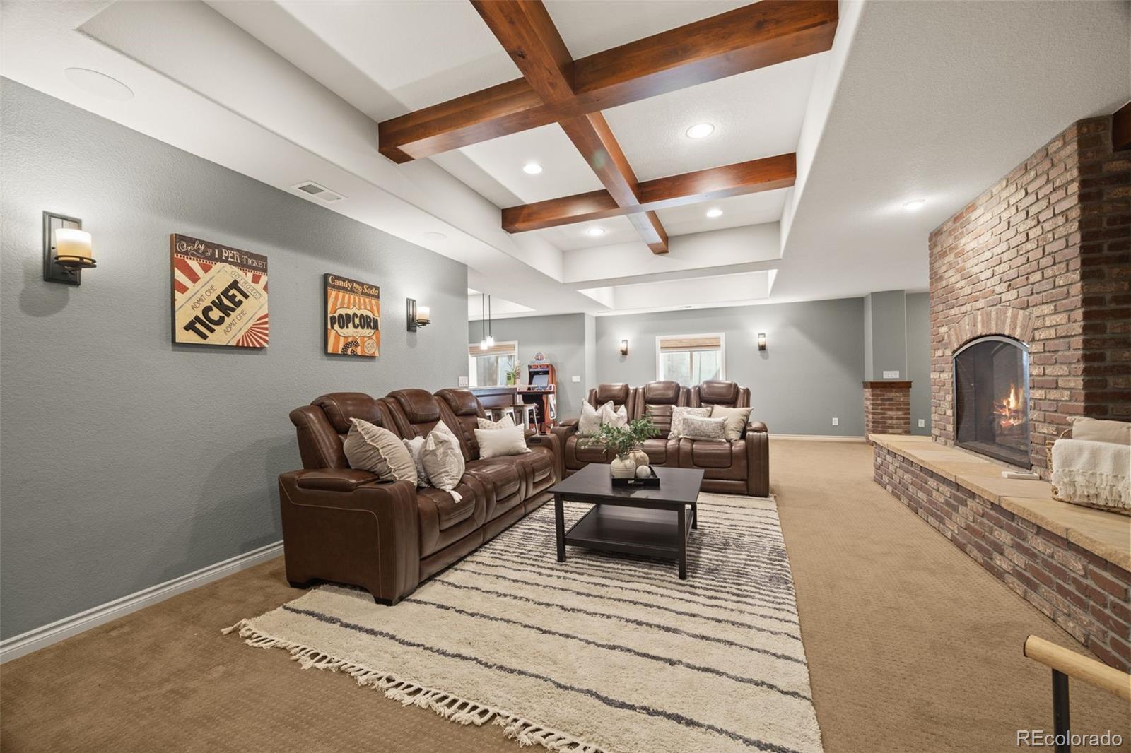 10466 Marigold Court Highlands Ranch, CO 80126 - Photo 31 of 50 a living room with furniture and a fireplace